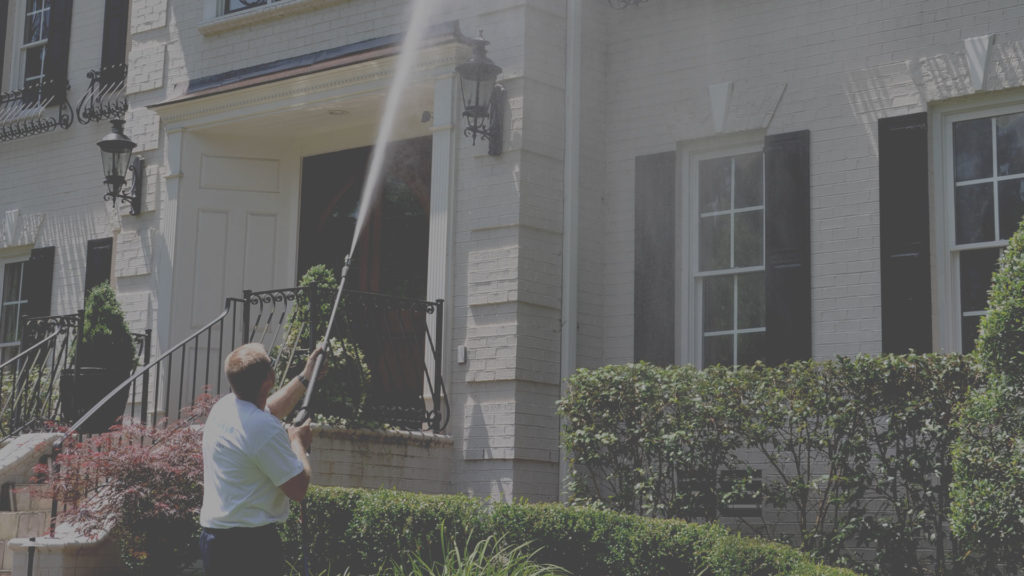 Pressure washing a house in Raleigh NC
