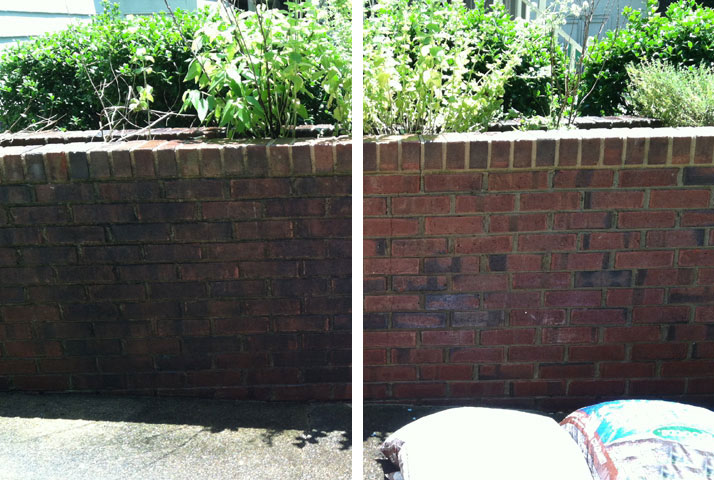 brick wall pressure washed at a commercial complex